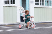 #color_all Child riding the JMMD A7 pink tricycle outdoors