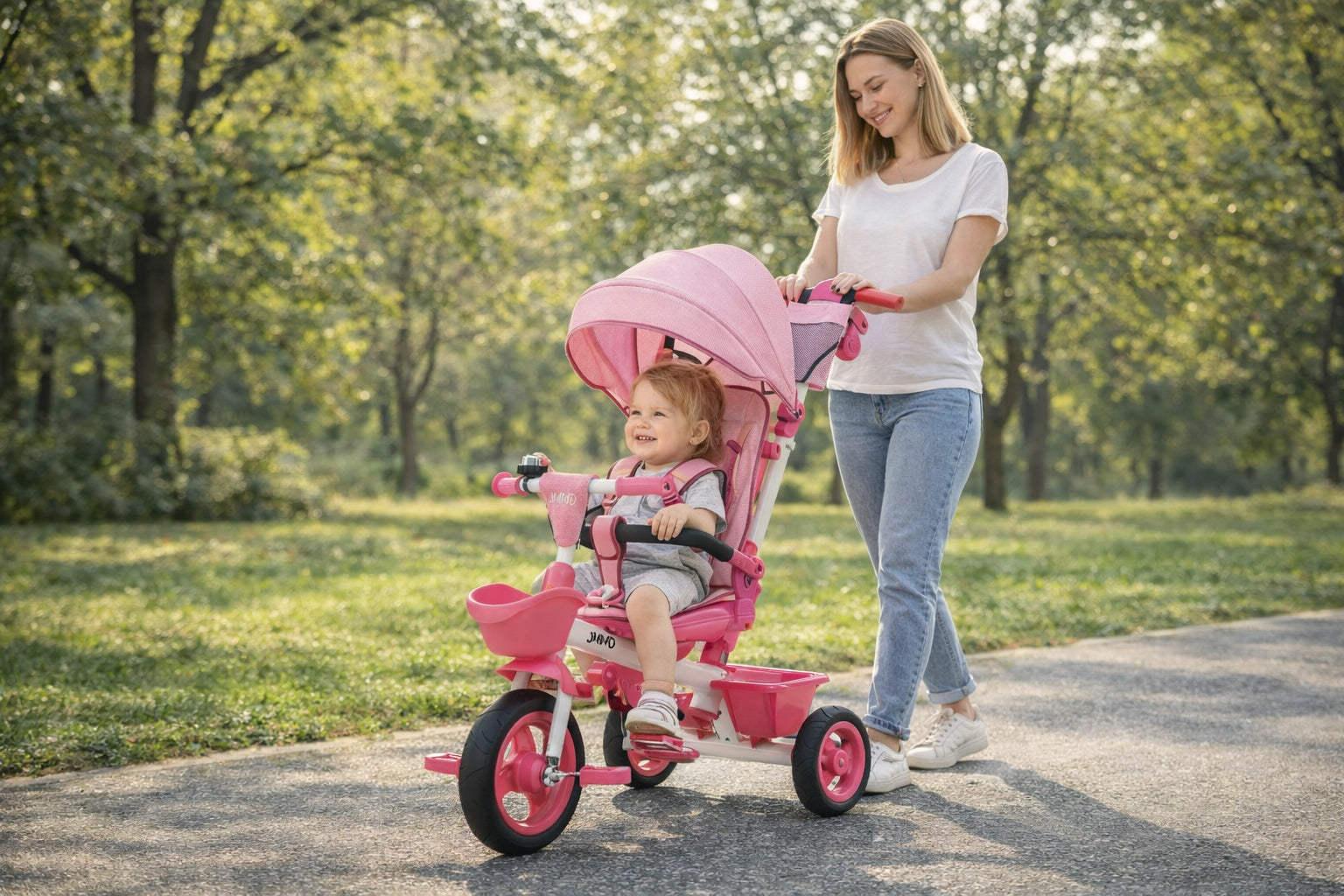 Mother pushing JMMD B31 toddler tricycle with child seated, outdoor park use for kids ages 1 to 5