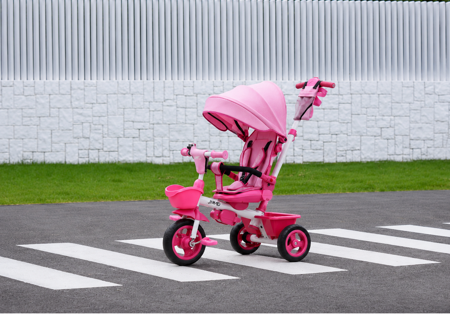 JMMD b31 pink kids tricycle displayed outdoors on a crosswalk