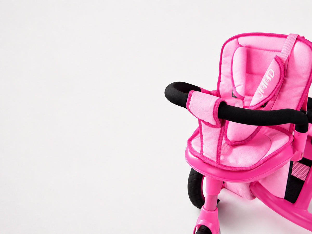 Close-up of the JMMD B31 pink seat with removable padded safety guardrail on a white background
