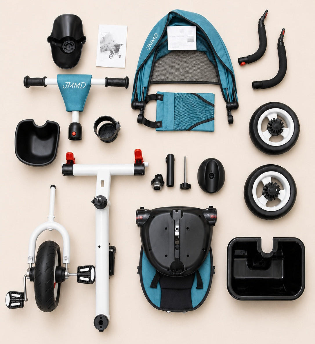 JMMD B31 trike parts flat lay arranged on a beige studio background