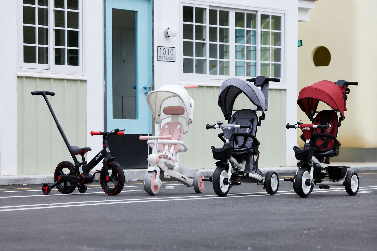 JMMD kids tricycles and bike displayed outdoors in multiple color options