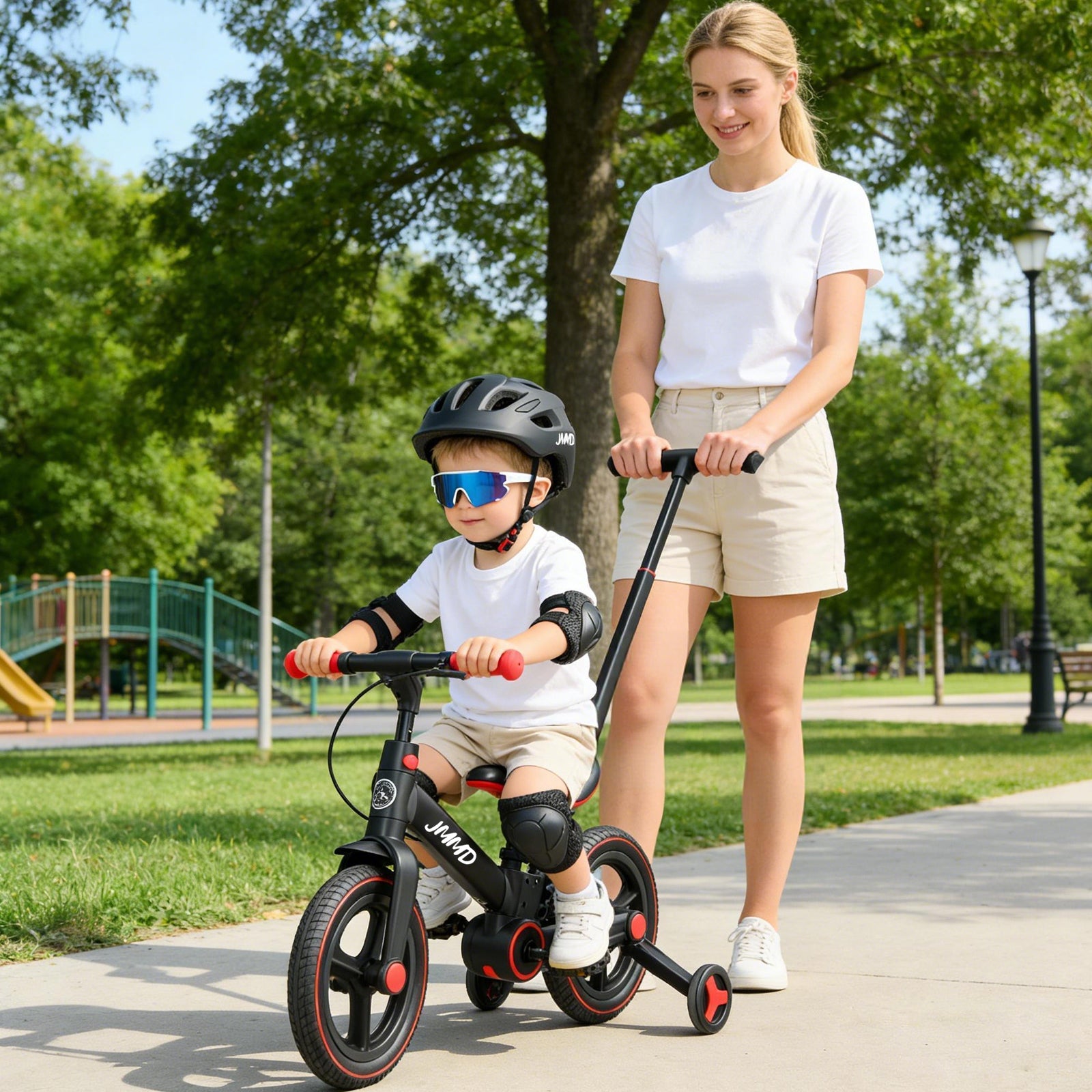 Parent pushing JMMD toddler tricycle while child rides in park