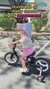 Toddler using the JMMD S900 Grow-With-Me Bike with parent assistance indoors and outdoors