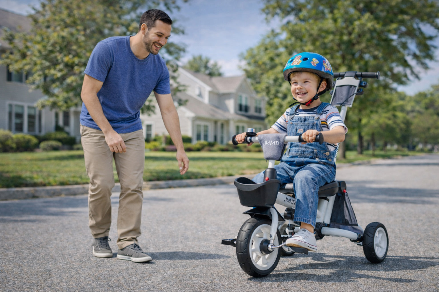 Toddler riding tricycle independently with parent walking beside for support